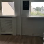 Radiatorbeklding en vensterbank